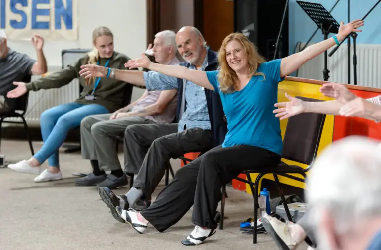 group taking part in chair bases exercise