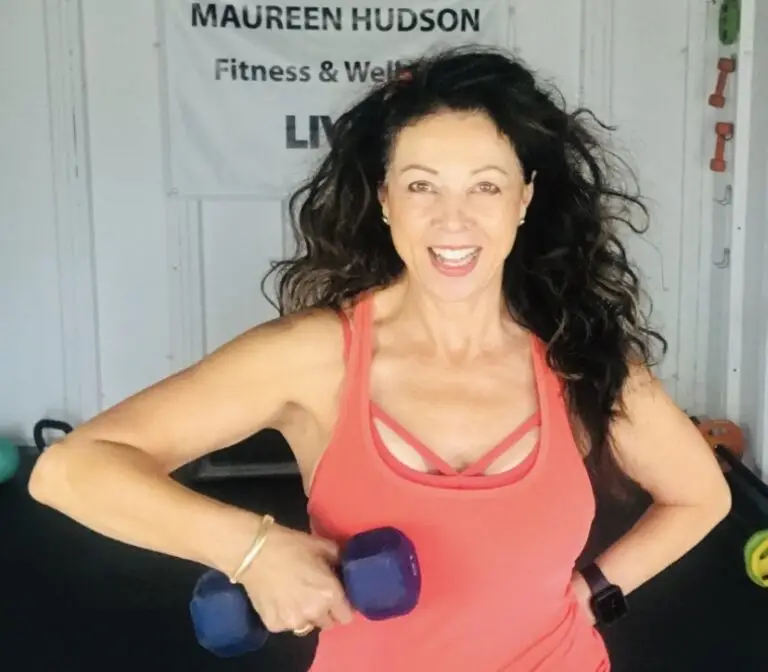 Maureen Hudson dressed in workout clothing and lifting a small weight