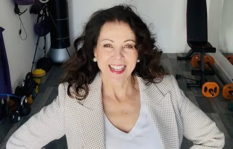 Maureen Hudson smiling in a gym setting.
